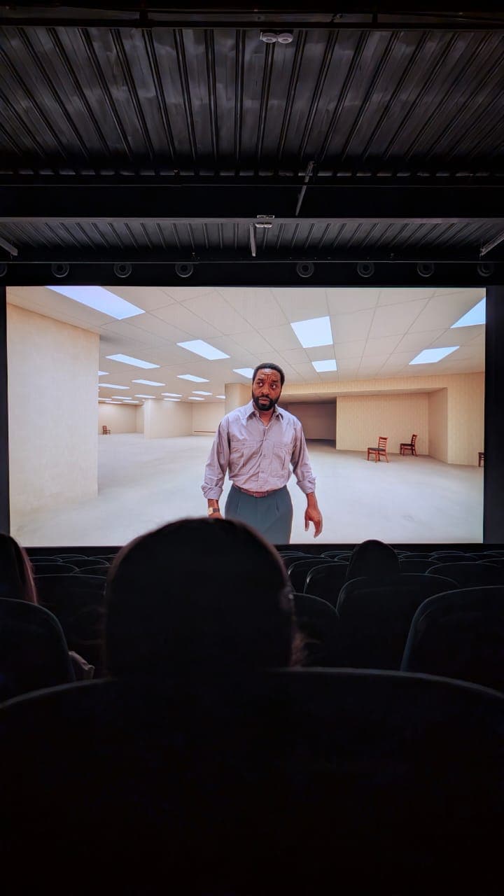 Rows of red velvet seats in an old cinema