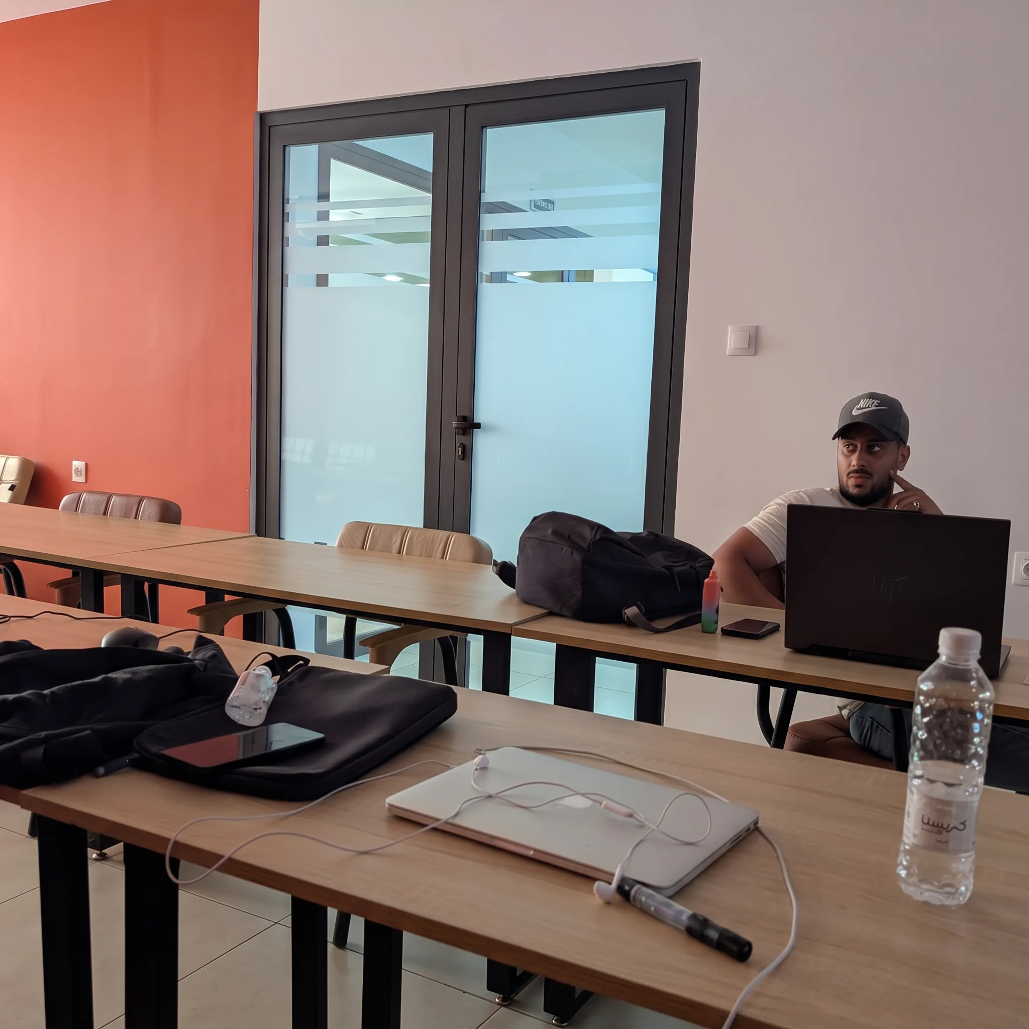 Two people working side by side at a shared table