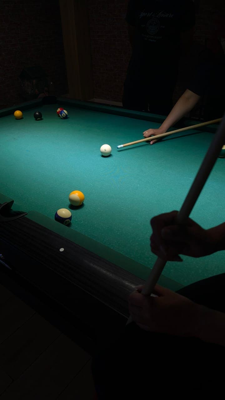 Billiard balls racked on green baize